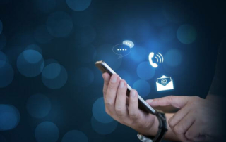 Close-up of someone using a phone for a bunch of different communication methods that rely on hospitality data