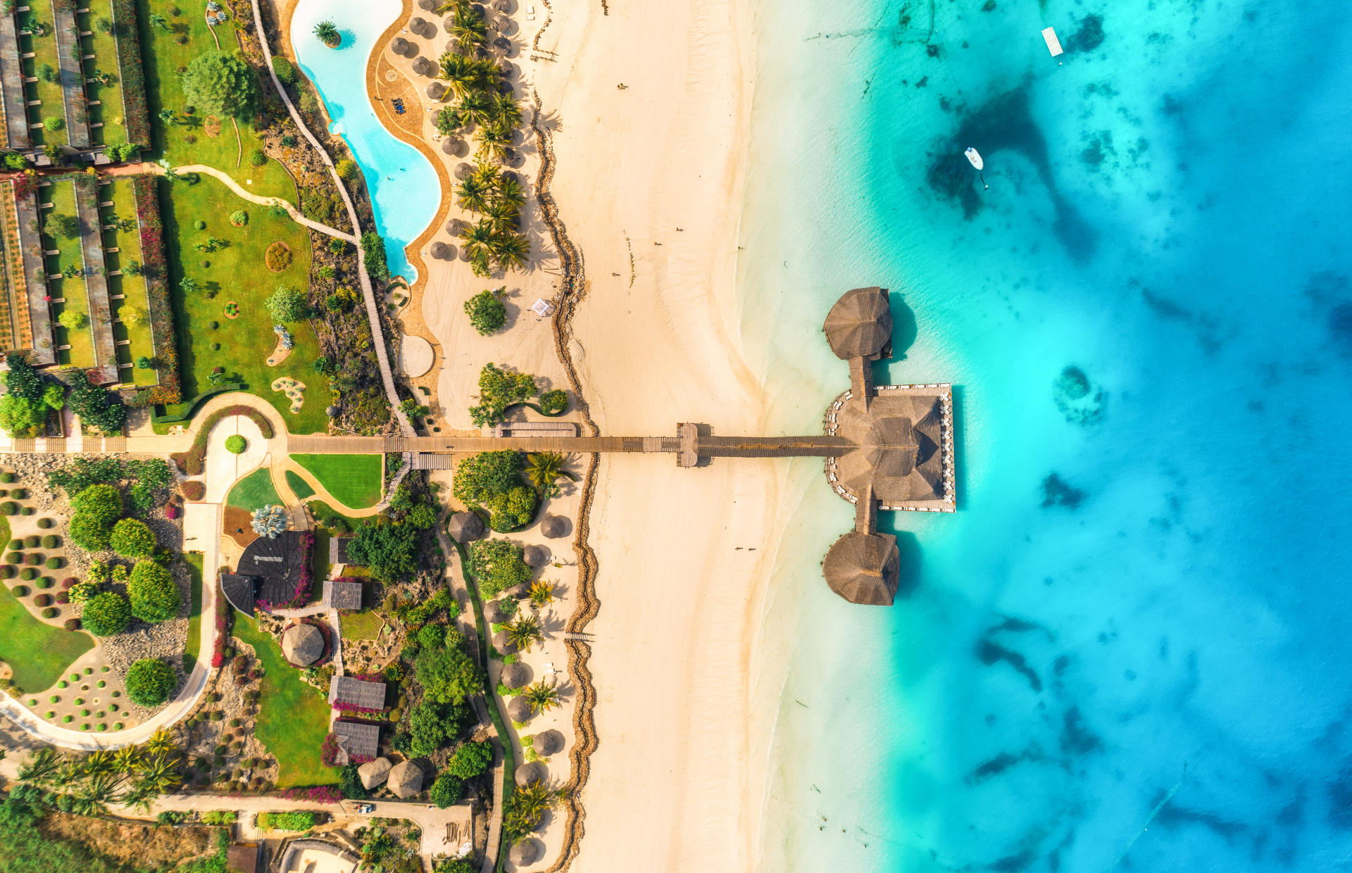 An aerial view shows a hotel by the Indian Ocean.