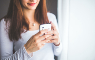 A person texts on their phone.