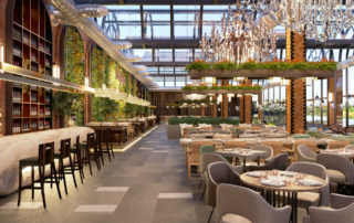 A hotel dining room is decorated with chandeliers and hanging plants.