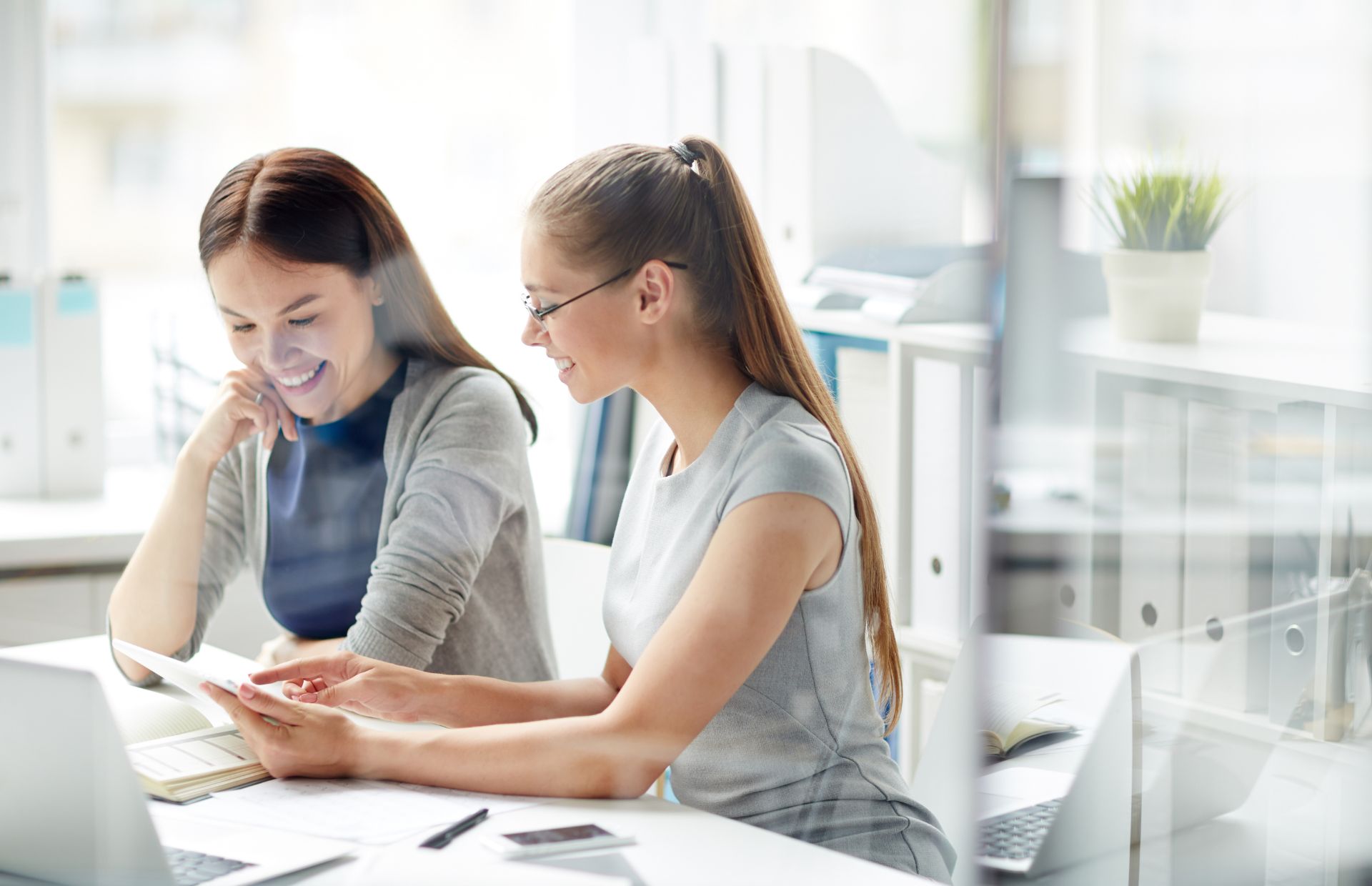 Two women working together