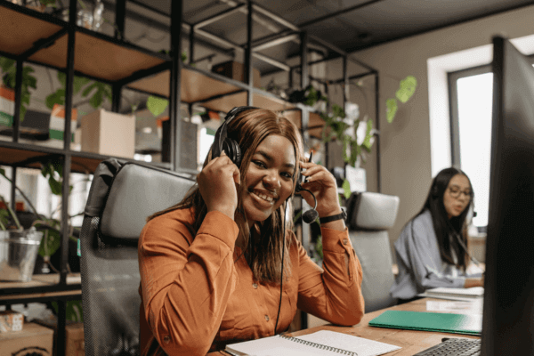 A call center agent wears a headset.