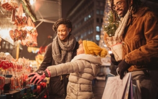 Family of three at Christmas market