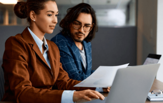 Two people analyzing data.