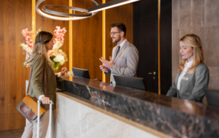 Woman checking in to hotel