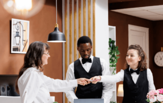two hotel concierges and guest
