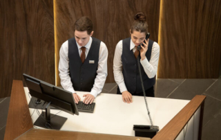 Male and female hotel receptionists