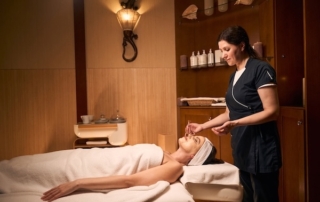 A woman enjoys spa treatment at a hotel.