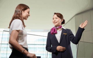 Hotel staff welcoming guest at check-in