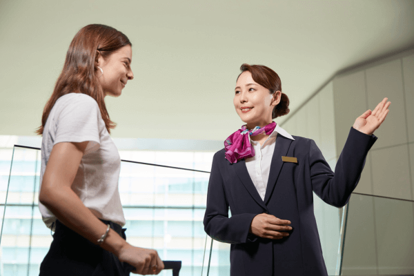 Hotel staff welcoming guest at check-in