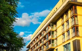 Warm-colored hotel against a blue sky