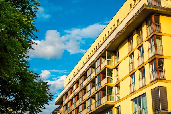 Warm-colored hotel against a blue sky