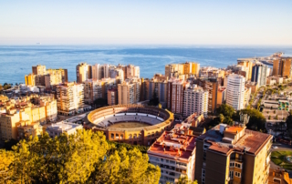 Stadium surrounded by hotels.